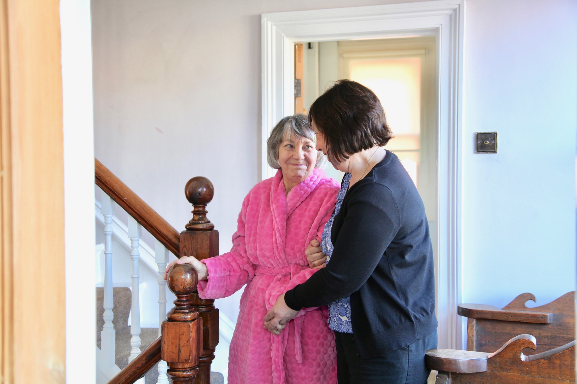 Female caregiver helping female client